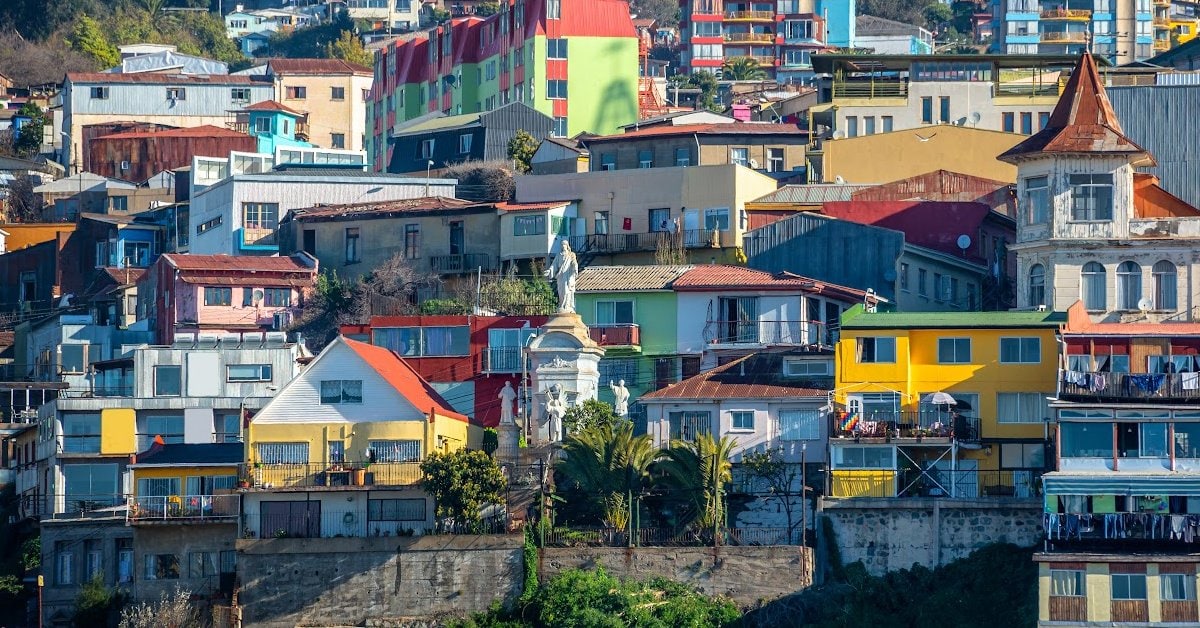 Colorful hillside houses in San Francisco, vibrant urban neighborhood with diverse architecture and scenic city views.