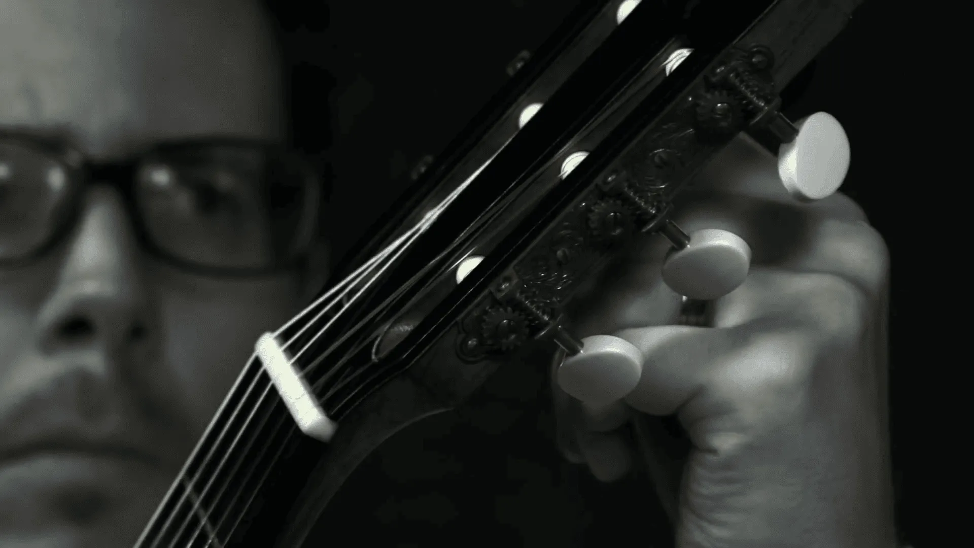 classical guitarist Dr. Sam Desmet performing on stage